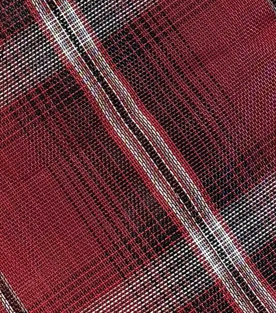 Red and black and white Textilene plaid fabric swatch.