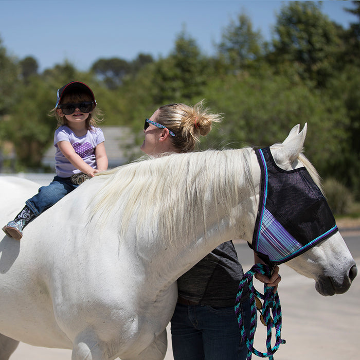 Woman child and horse. Purple plaid with black mask